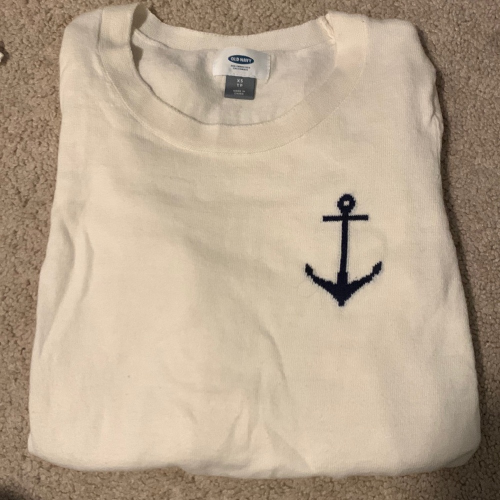 White sweater with an anchor